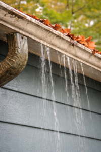 Mobile home gutters before repair showing sagging and damage.