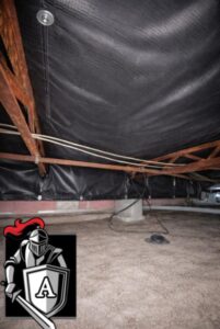 Professionally repaired vapor barrier installed under a mobile home, protecting floor framing from moisture, mold, and ground humidity.